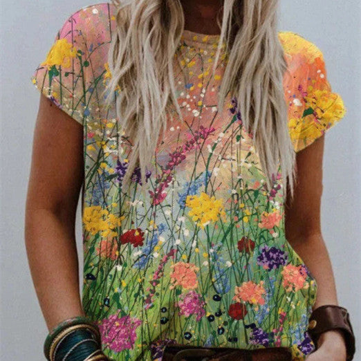 Sabrina - Blusa a maniche corte con stampa floreale vivace