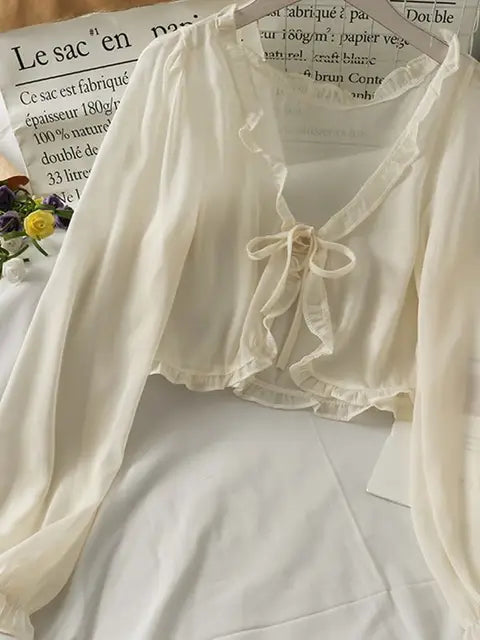 Luciana - Camicetta traslucida con fiocco